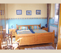 Das Schlafzimmer in der Ferienwohnung Bauernhaus auf dem Ferienhof Epker im Münsterland