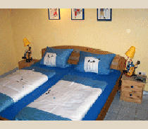 Das Schlafzimmer in der Ferienwohnung Sonnengarten auf dem Ferienhof Epker im münsterländischen Steinfurt